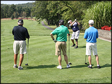 Men on the golf course at a Chapter golfing event.